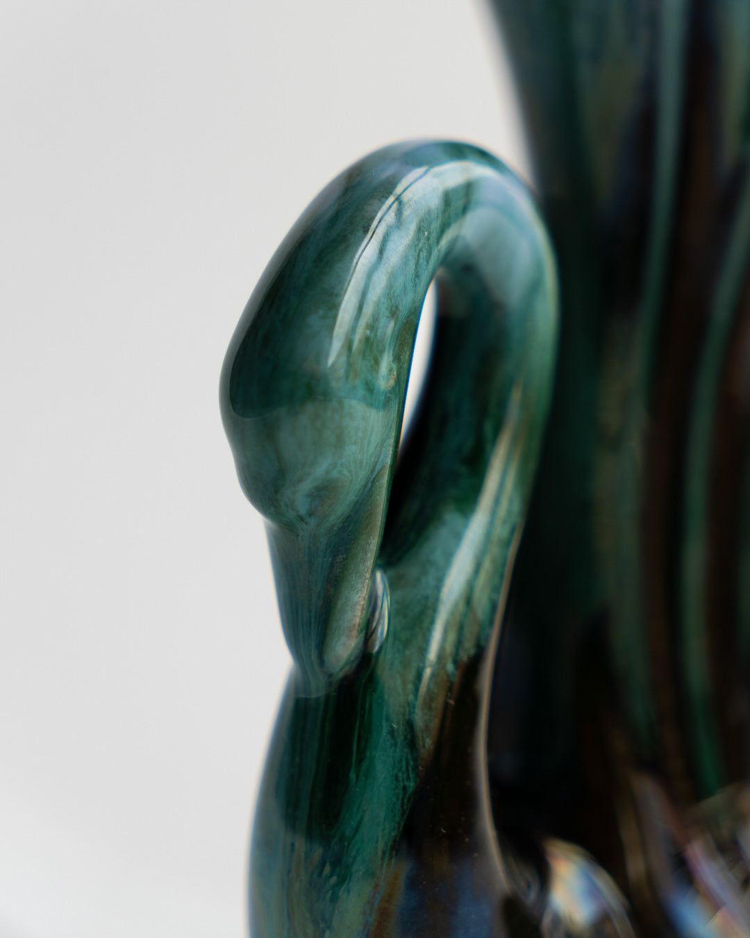 Vintage Blue Mountain Pottery swan-shaped vase with signature blue-green glaze and elegant mid-century modern curves, made in Canada - Vecino Shop
