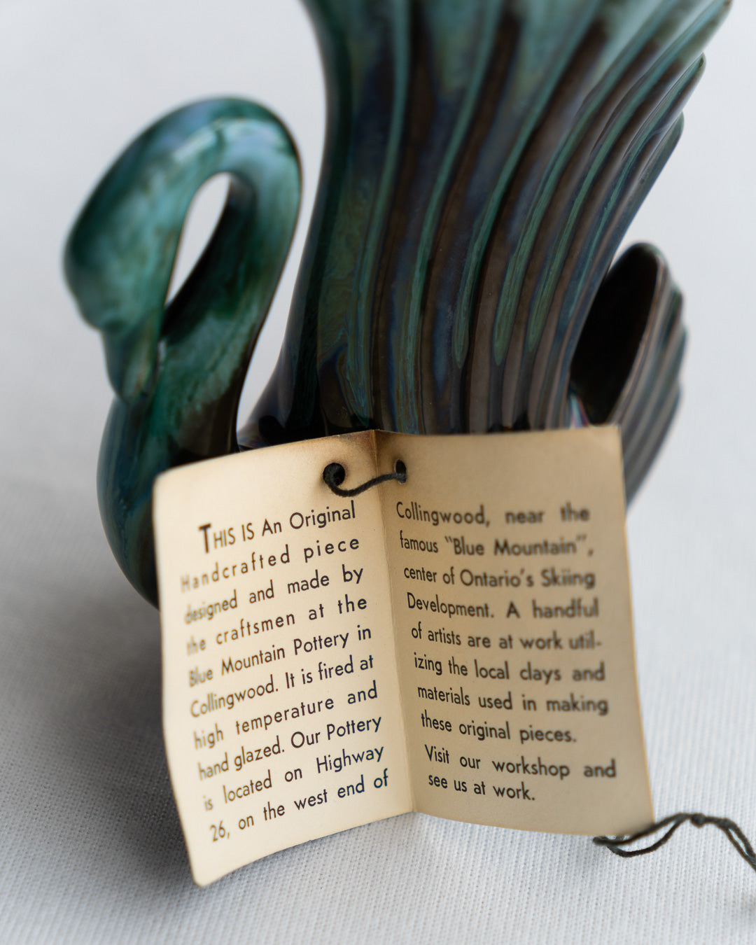 Vintage Blue Mountain Pottery swan-shaped vase with signature blue-green glaze and elegant mid-century modern curves, made in Canada - Vecino Shop