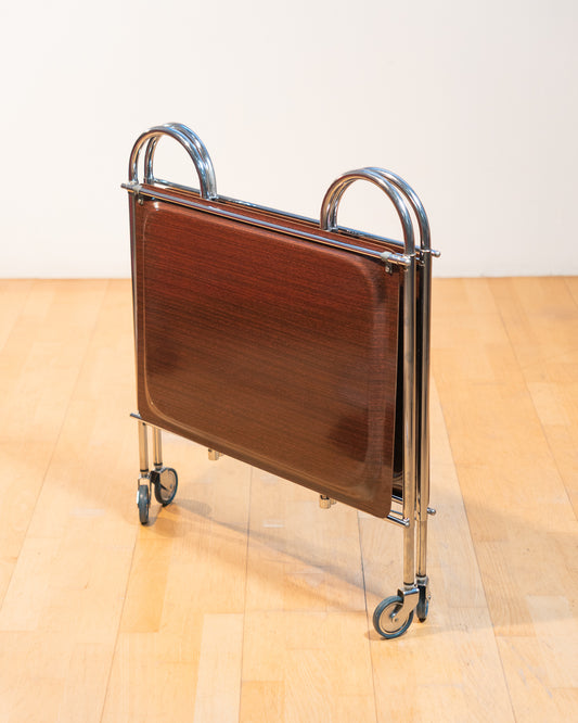 Vintage 1960s Arch folding serving trolley with chrome frame and wood veneer trays, Mid-Century modern bar cart with integrated drink holder accessory, compact foldable design – Vecino Shop
