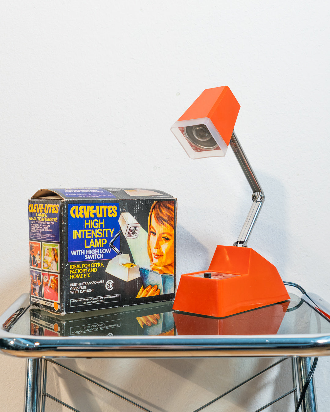 Rare vintage Cleve-Lite JetSet folding lamp in orange plastic. 1970s space age design with night light function. Includes original box– Vecino Shop