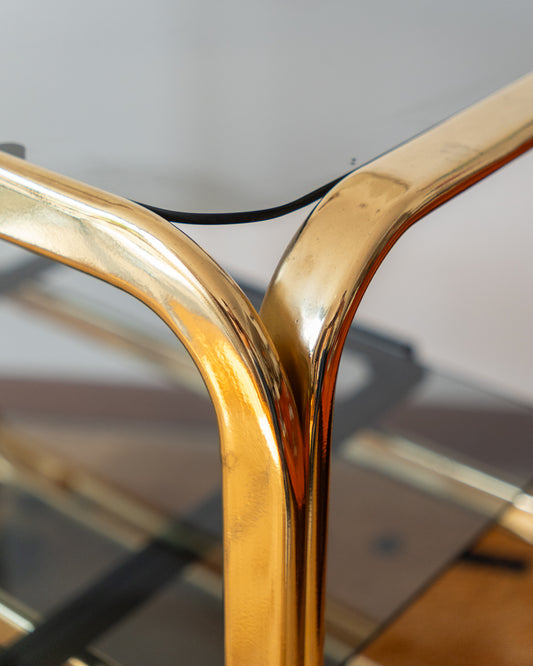 Vintage 1970s gold and smoked glass 3-tier side table, middle sliding shelf, wheels, polished and restored, very good condition | Vecino Shop