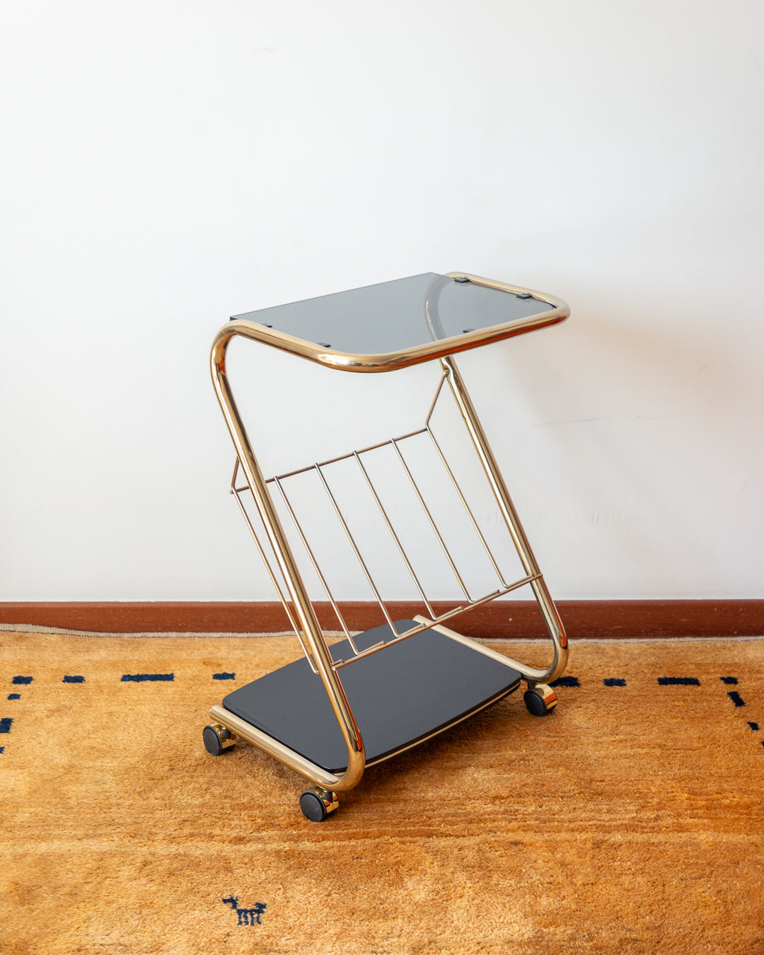 Vintage 80s rolling side table with golden frame, glass top and wood shelf – Vecino Shop