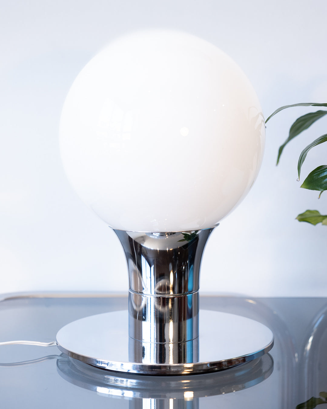 Vintage Space Age table lamp with sculptural chrome base and white opaline glass globe – Vecino Shop