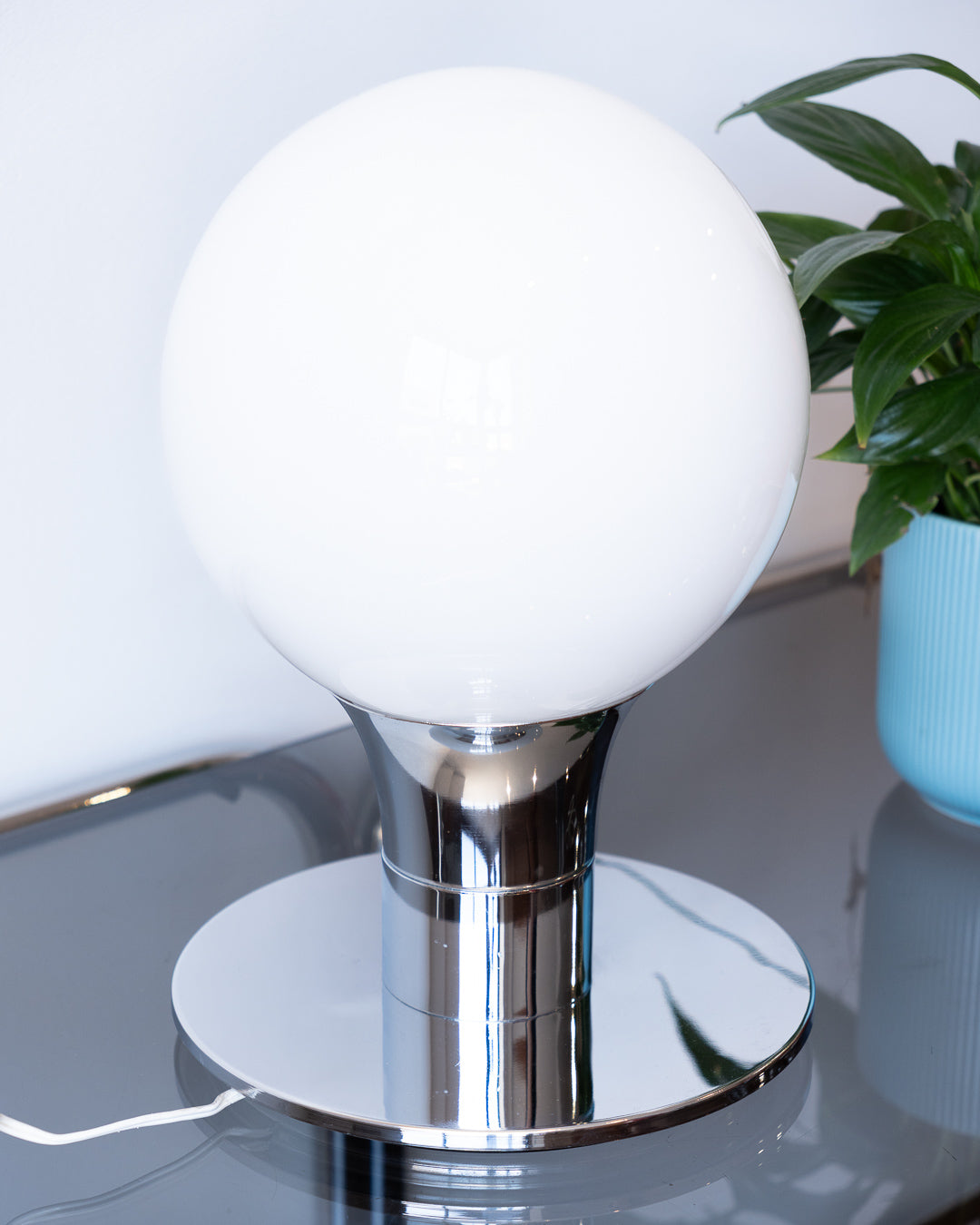 Vintage Space Age table lamp with sculptural chrome base and white opaline glass globe – Vecino Shop