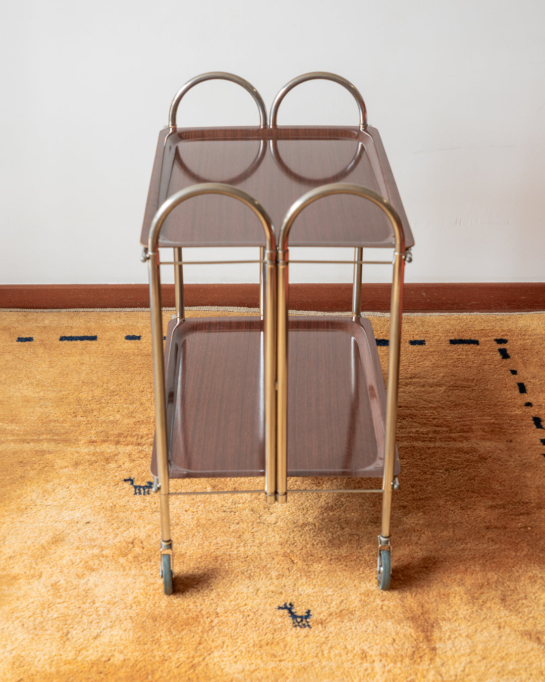 Vintage 1970s folding serving trolley with rare arched chrome frame and wood veneer shelves