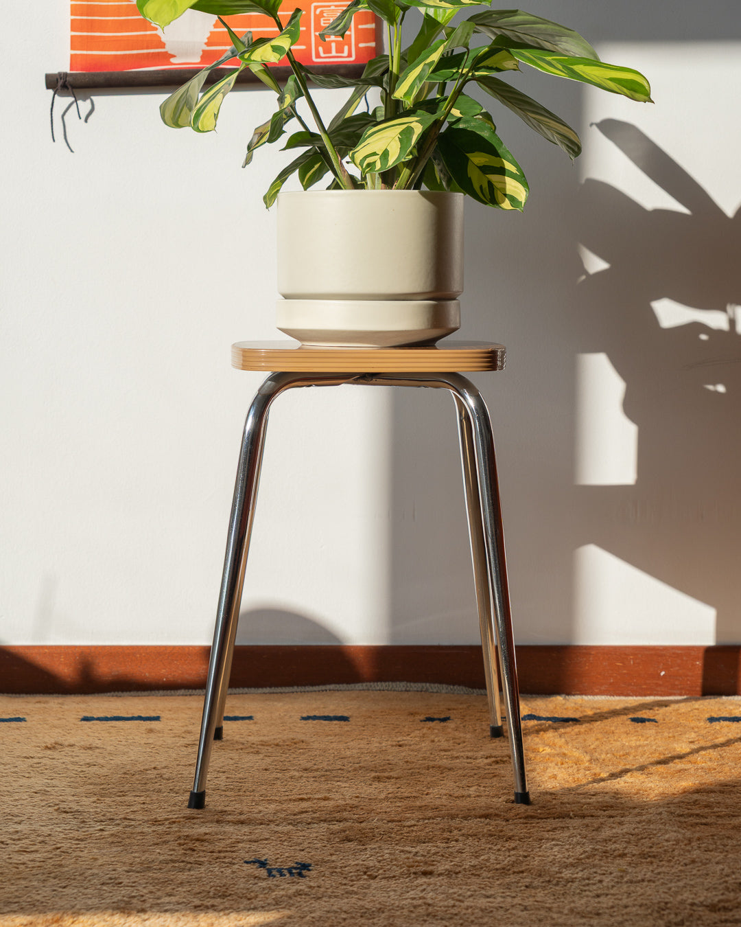 Vintage 1960s mid-century modern wooden laminate stool with shiny chrome legs, simple and elegant design – Vecino Shop.