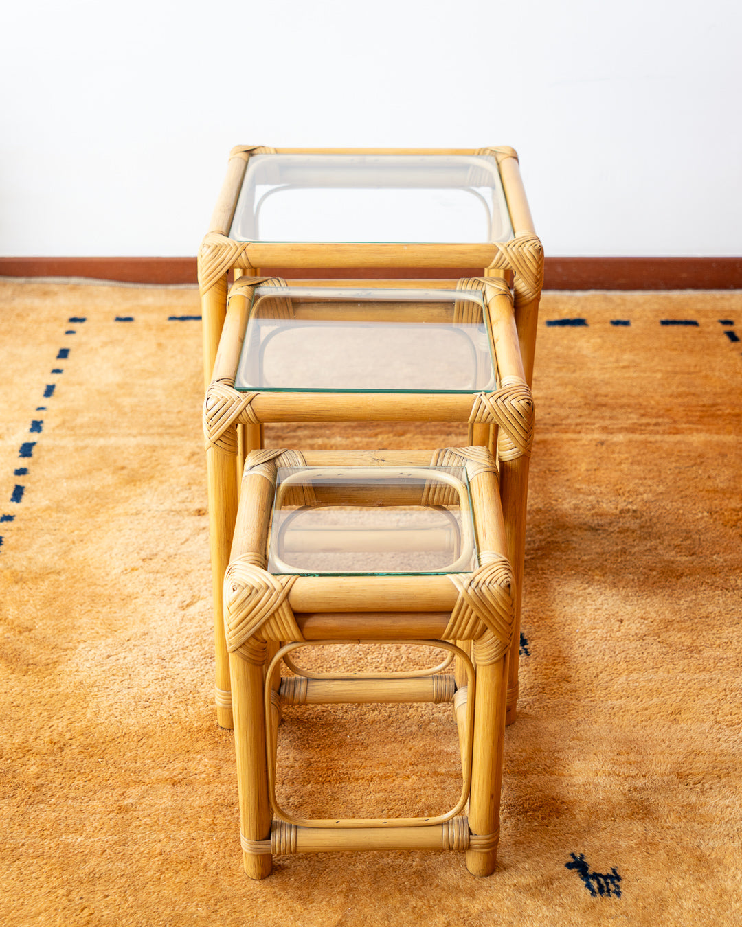 1970s vintage bamboo nesting tables with glass tops – boho accent set. Vecino Shop.