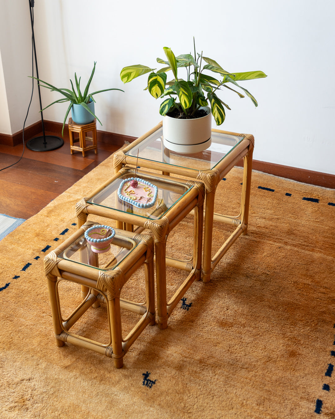 1970s vintage bamboo nesting tables with glass tops – boho accent set. Vecino Shop.