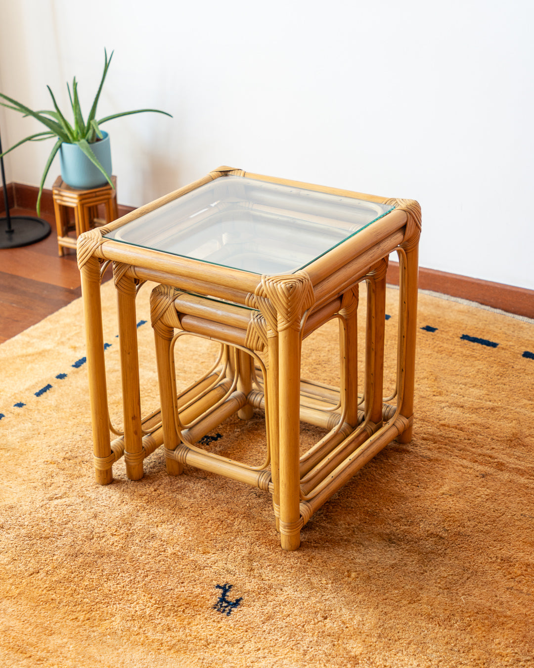 1970s vintage bamboo nesting tables with glass tops – boho accent set. Vecino Shop.