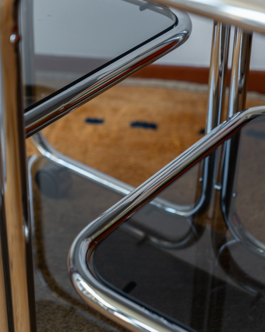 Vintage chrome side table with 4 smoked glass tiers, 1970s, restored and polished, available at Vecino Shop, Barcelona, worldwide shipping.