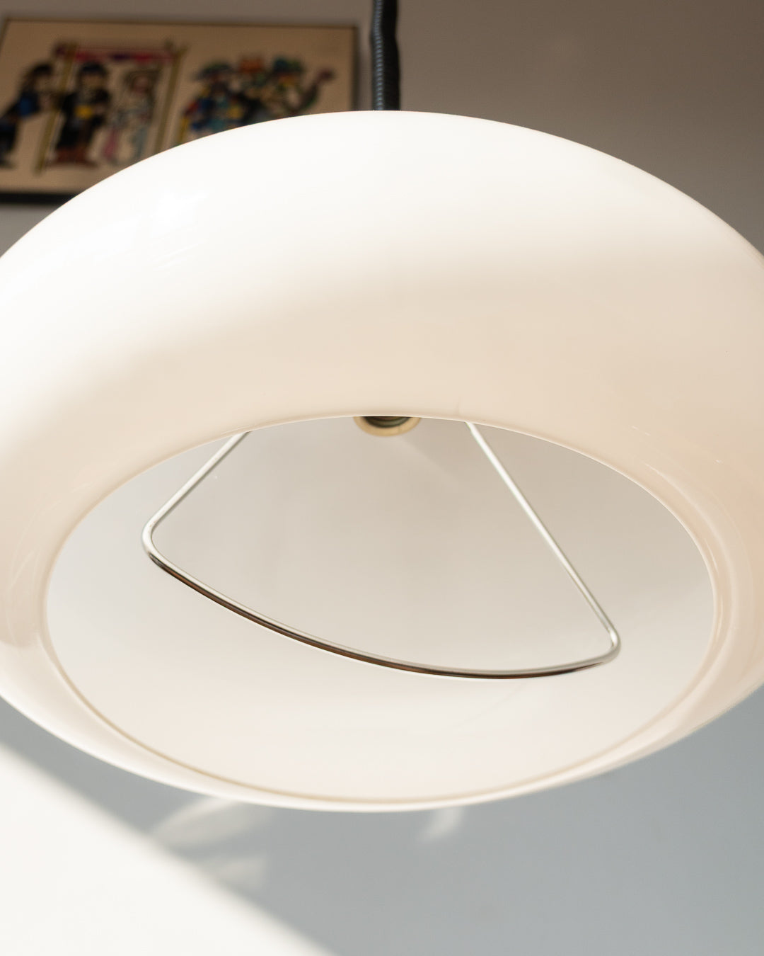 Retro 1960s/70s extendable Space Age ceiling lamp with white plastic shade, chrome accents, and black spiral cord. Sculptural, functional, and iconic.