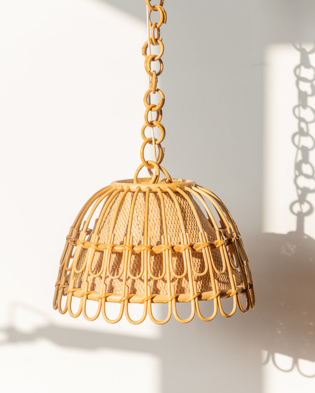 Vintage 1960s handwoven wicker ceiling lamp with natural texture and boho style. A warm, organic statement light for living rooms, bedrooms, or studios.