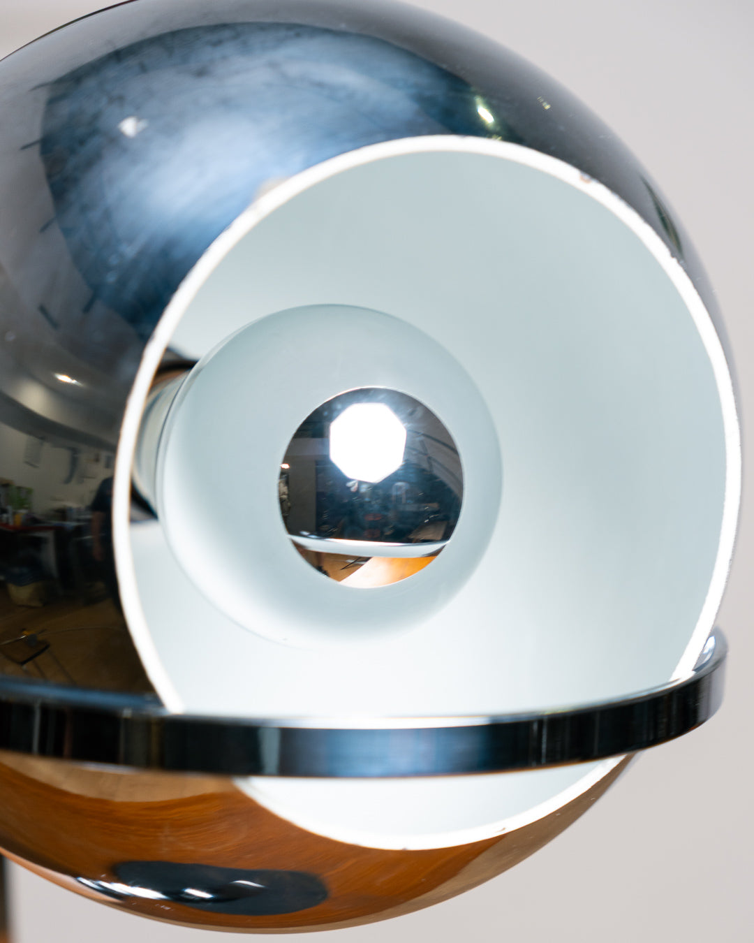 Vintage 1970s chrome floating eyeball desk lamp with sculptural base and adjustable spotlight. Vecino Shop