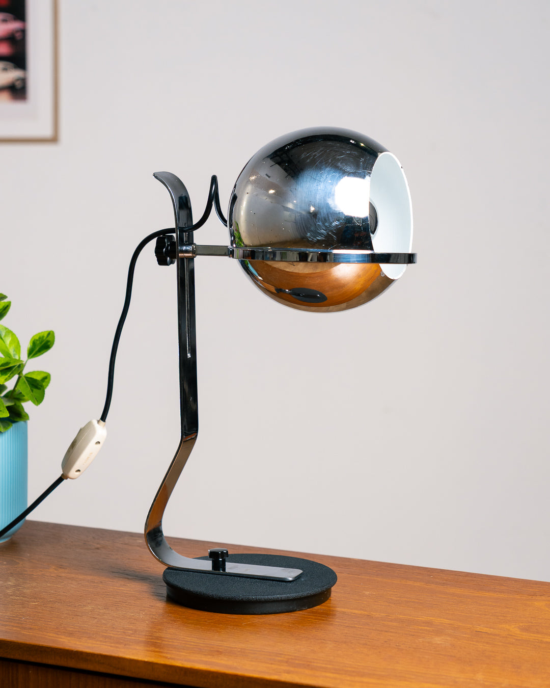 Vintage 1970s chrome floating eyeball desk lamp with sculptural base and adjustable spotlight. Vecino Shop