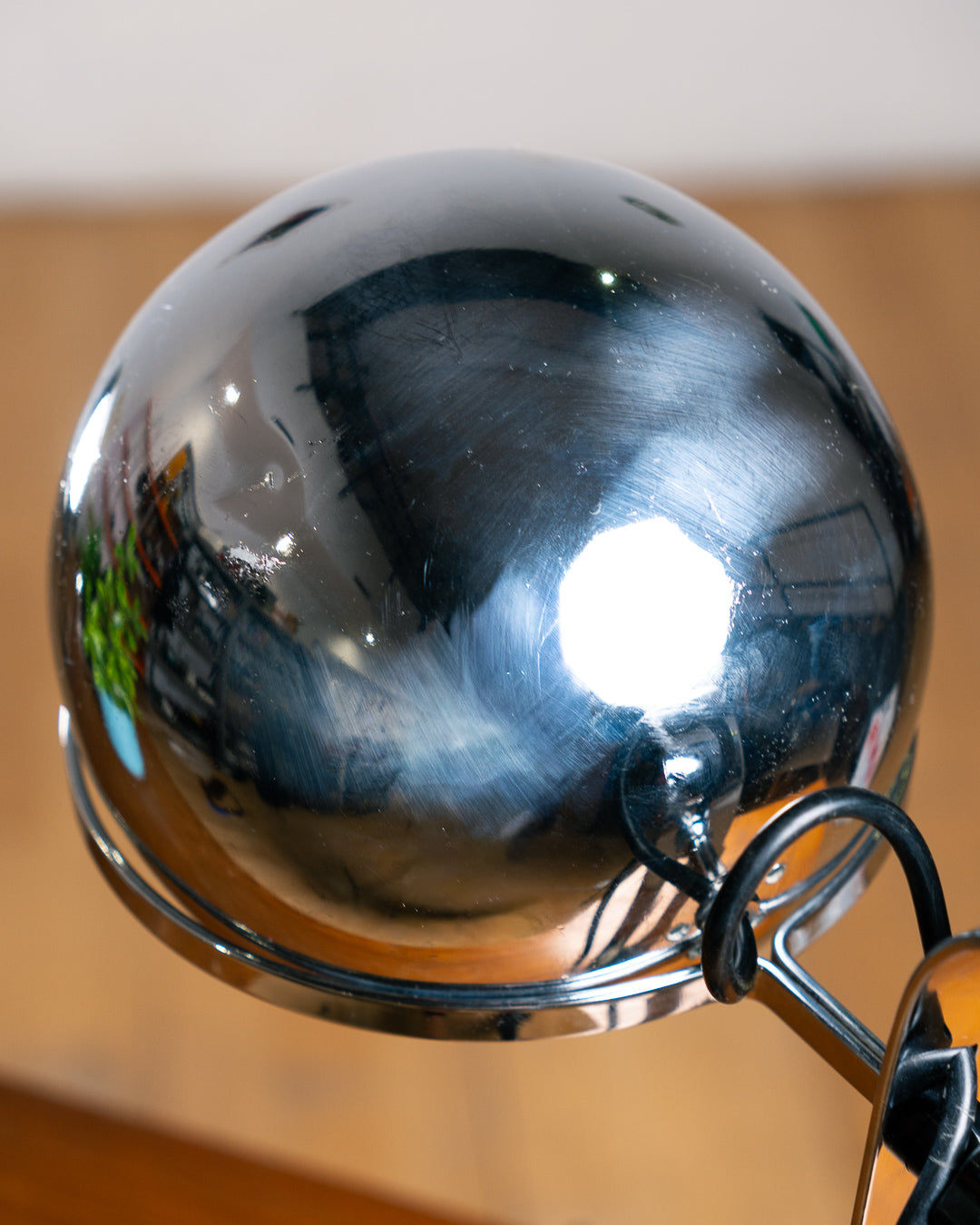 Vintage 1970s chrome floating eyeball desk lamp with sculptural base and adjustable spotlight. Vecino Shop
