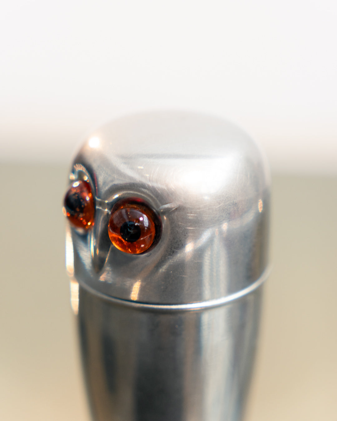 Vintage 1960s owl nesting shot glass set from West Germany with chrome body, amber eyes. Vecino Shop
