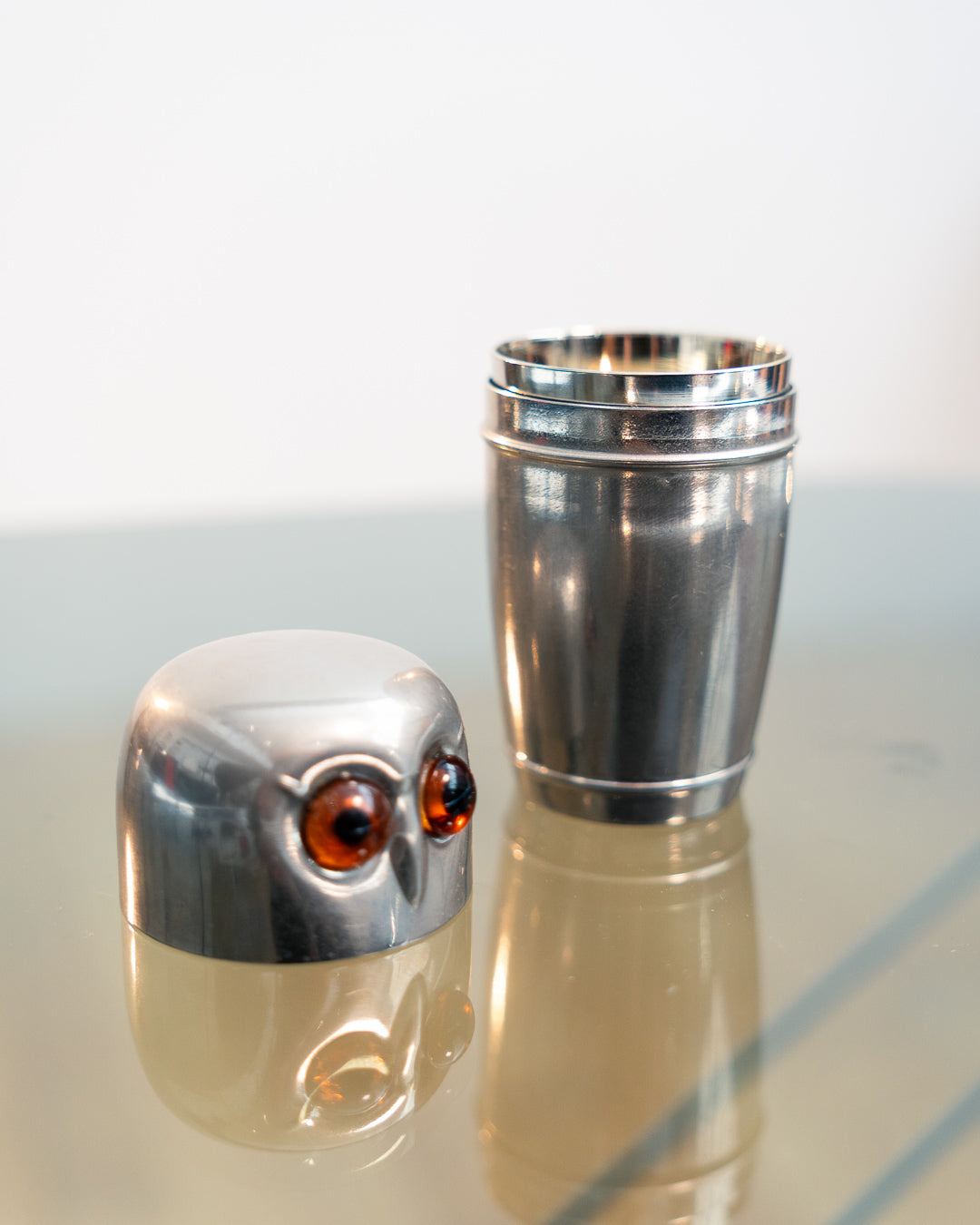 Vintage 1960s owl nesting shot glass set from West Germany with chrome body, amber eyes. Vecino Shop