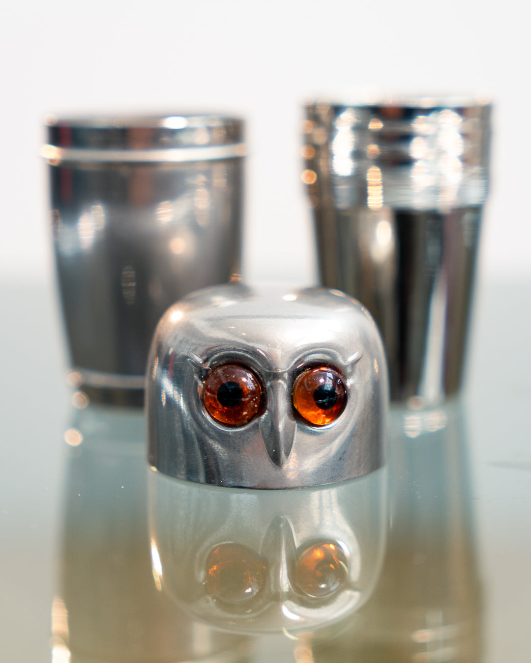 Vintage 1960s owl nesting shot glass set from West Germany with chrome body, amber eyes. Vecino Shop