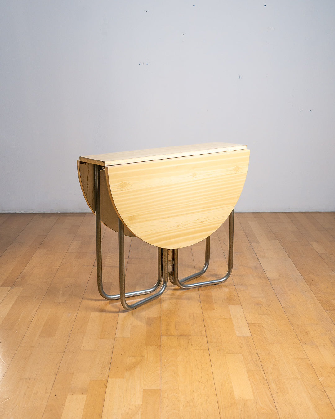 Vintage 1970s folding space-saving dining table with chrome tubular legs and a customizable Formica tabletop. Space Age style. Vecino Shop