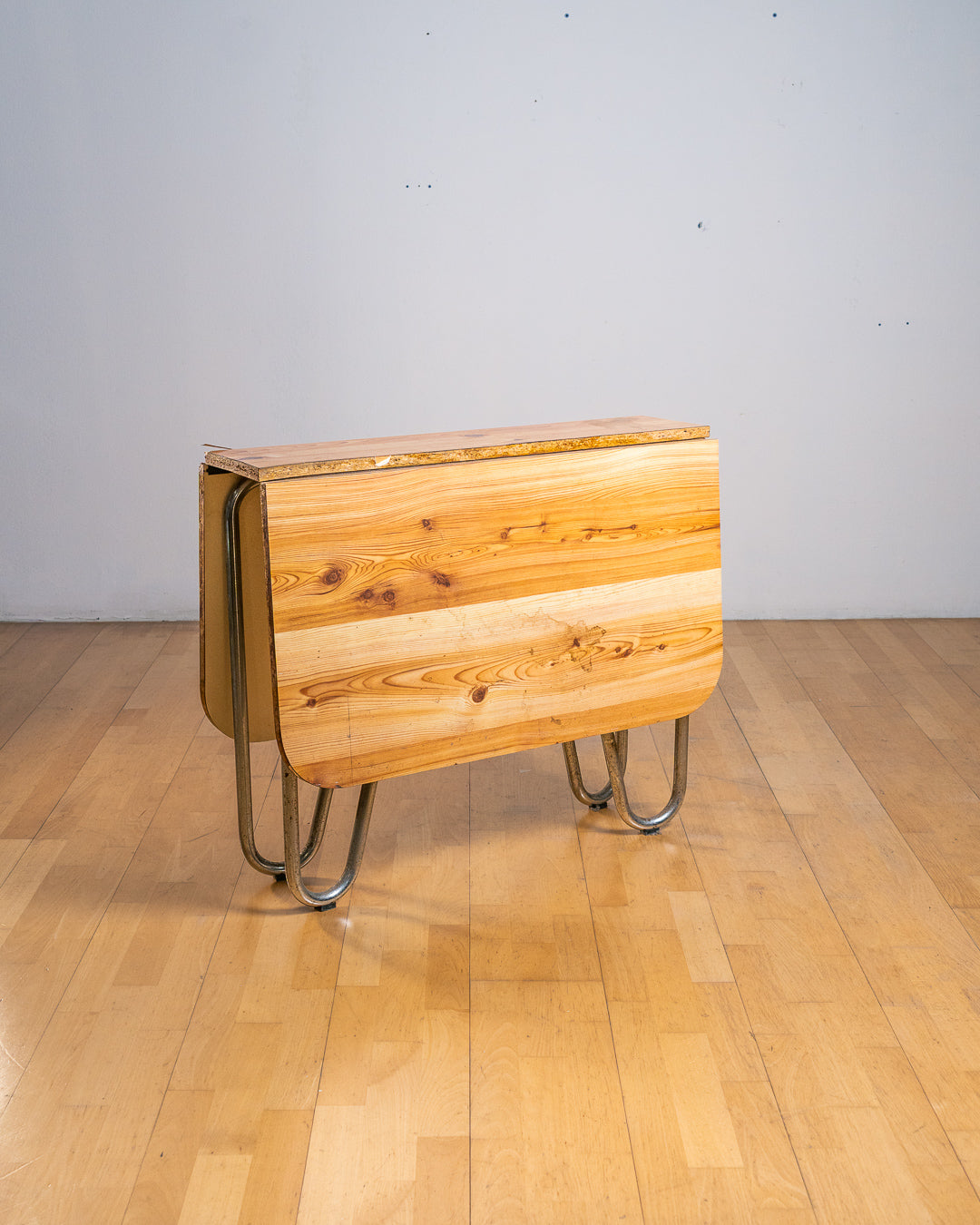 Vintage 1970s folding dining table with chrome tubular legs and a custom made Formica tabletop. Functional Space Age design. Vecino Shop