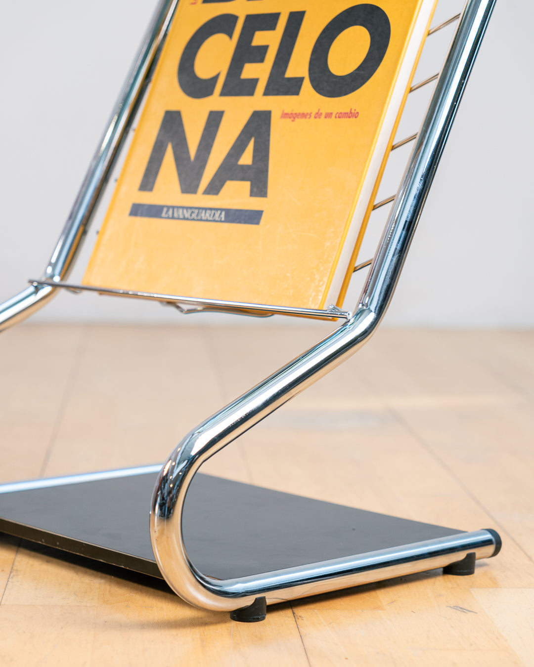 Vintage 1970s chrome side table with smoked glass top, black melamine shelf and integrated magazine rack. Vecino Shop