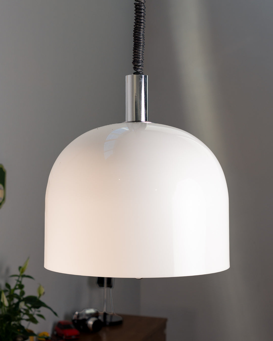 Vintage 1970s white acrylic dome extendable pendant lamp with chrome accents and adjustable coil, Space Age design. Vecino Shop