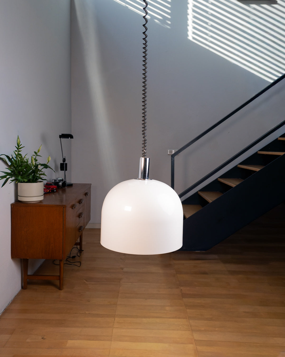 Vintage 1970s white acrylic dome extendable pendant lamp with chrome accents and adjustable coil, Space Age design. Vecino Shop