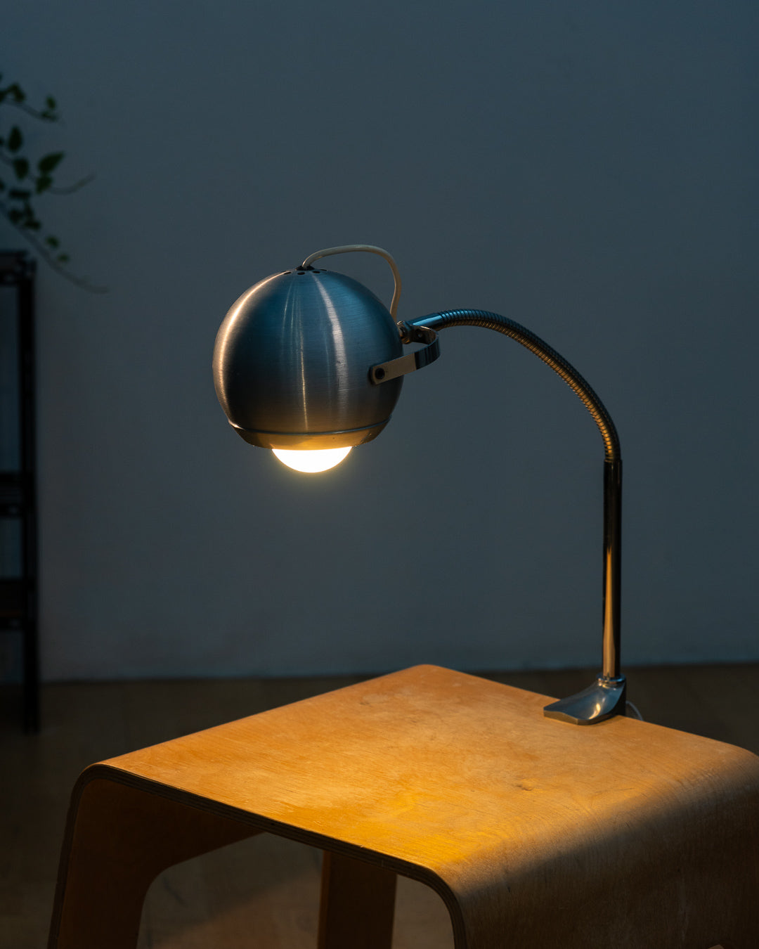 Vintage 1970s Aluminor eyeball clamp lamp with chrome shade, brushed steel finish, and flexible gooseneck. Made in France.