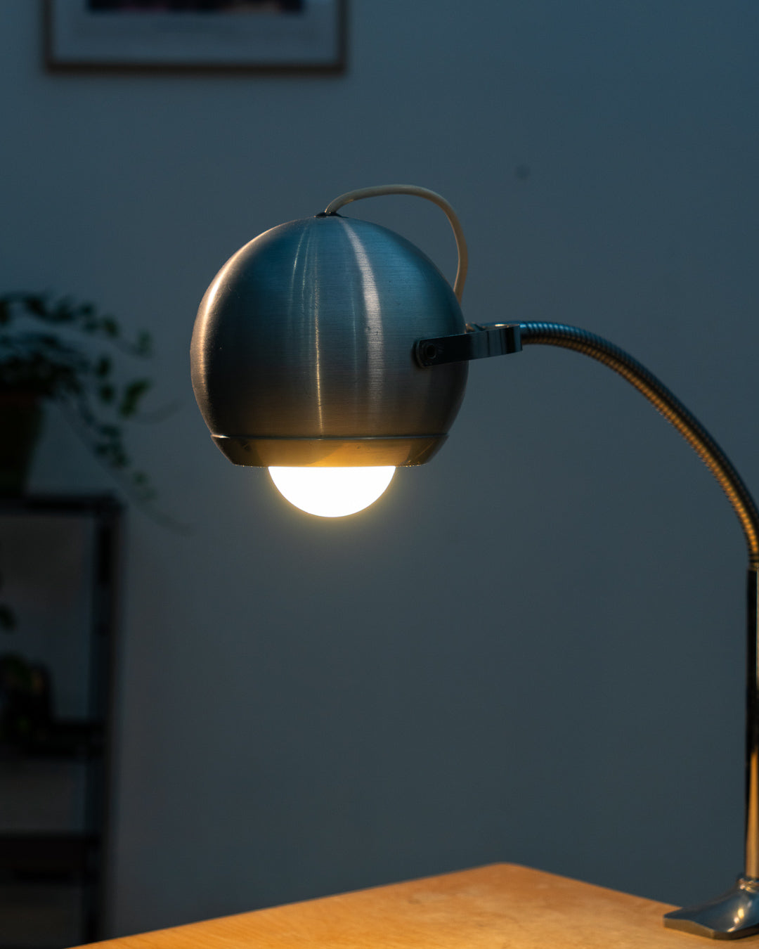 Vintage 1970s Aluminor eyeball clamp lamp with chrome shade, brushed steel finish, and flexible gooseneck. Made in France.