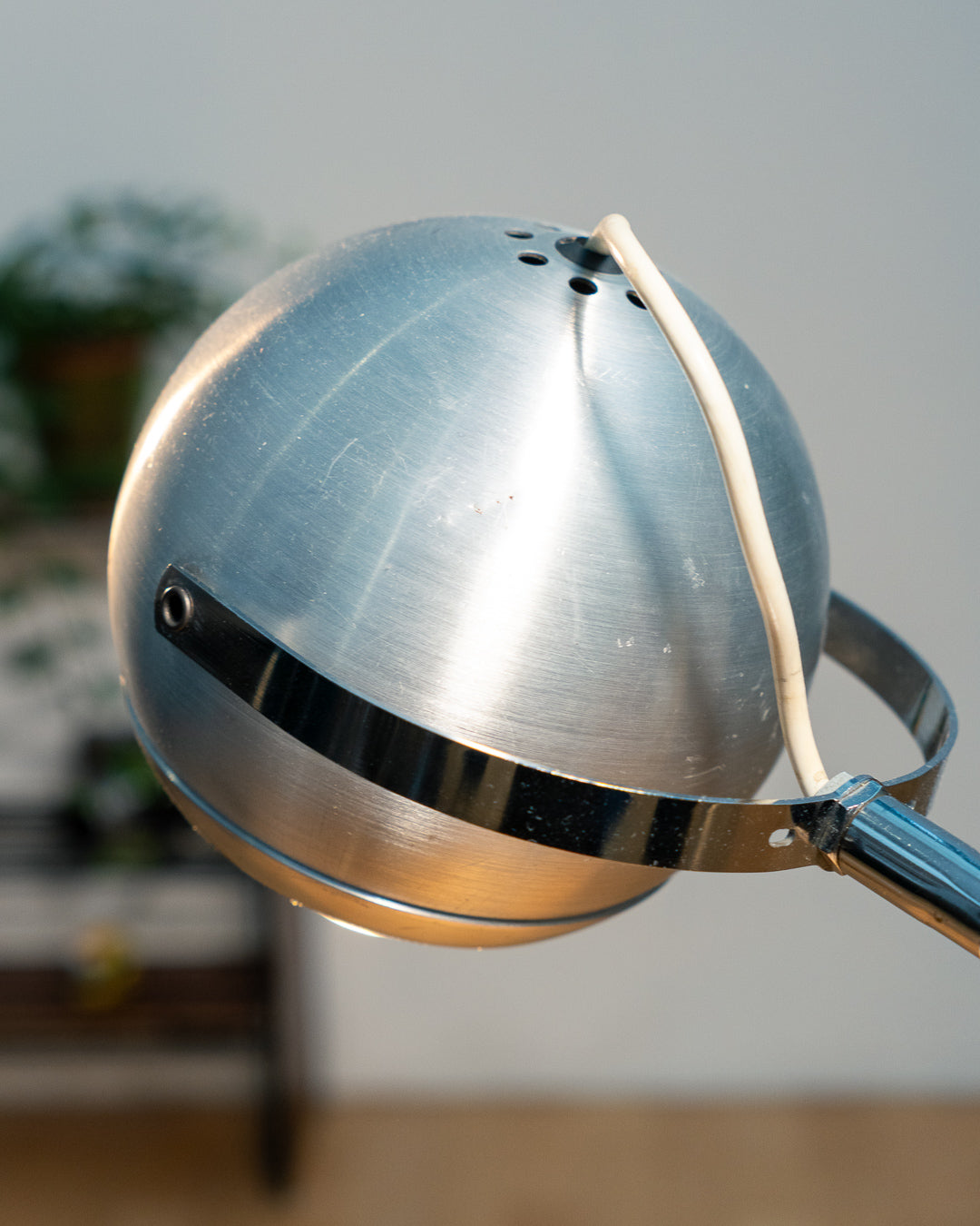 Vintage 1970s Aluminor eyeball clamp lamp with chrome shade, brushed steel finish, and flexible gooseneck. Made in France.