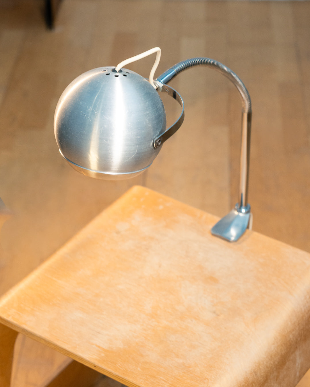 Vintage 1970s Aluminor eyeball clamp lamp with chrome shade, brushed steel finish, and flexible gooseneck. Made in France.