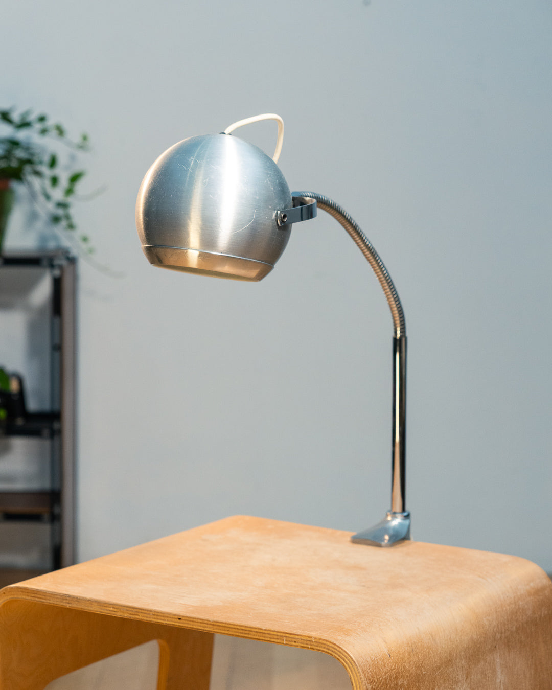 Vintage 1970s Aluminor eyeball clamp lamp with chrome shade, brushed steel finish, and flexible gooseneck. Made in France.