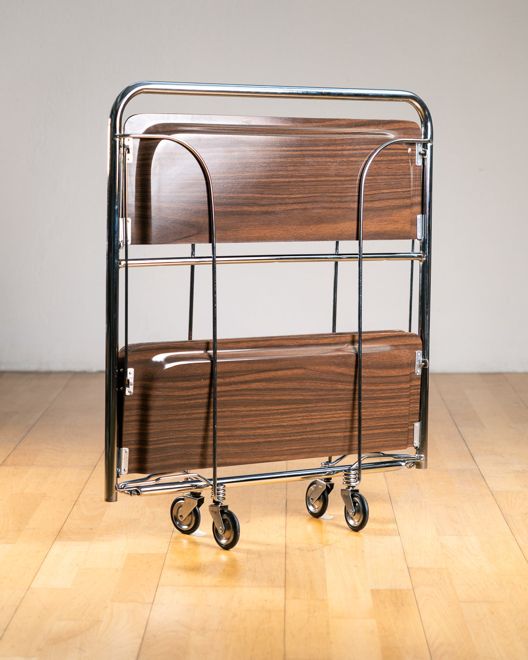 Vintage 1960s Raquer dark woodgrain folding trolley with  Formica shelves and chrome details. Bar Cart, drinks trolley. Mid Century Modern. Vecino Shop