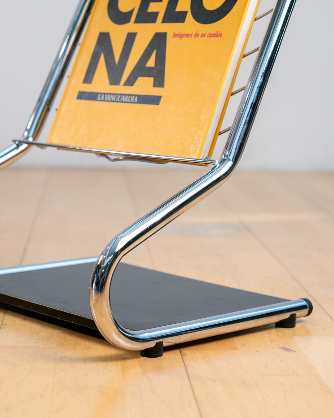 Vintage 1970s chrome side table with smoked glass top, black melamine shelf and integrated magazine rack. Vecino Shop