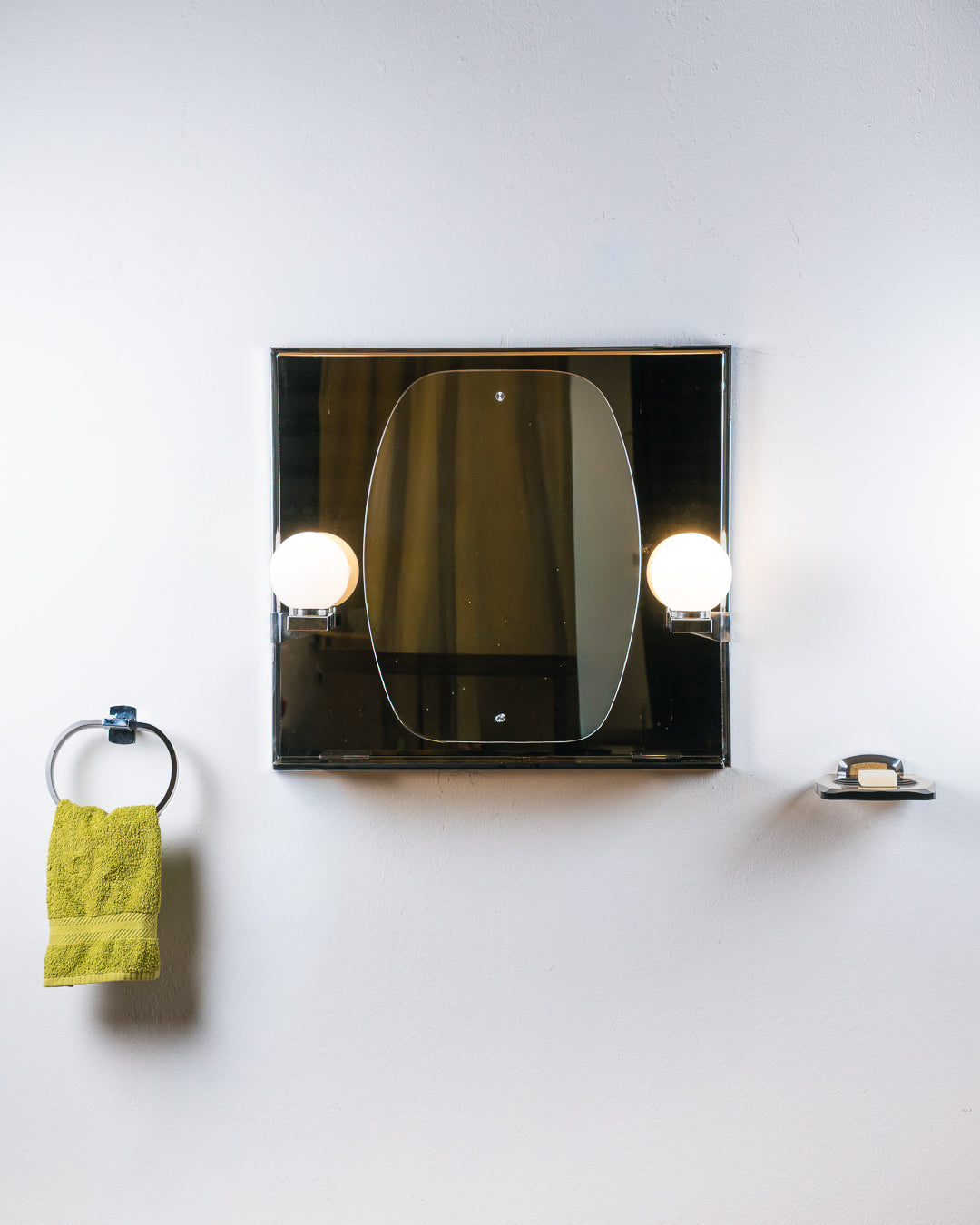 Vintage Space Age smoked black glass bathroom set from the 1970s with illuminated mirror, opaline globe sconces, shelf, acrylic towel holder and soap holder. Vecino Shop