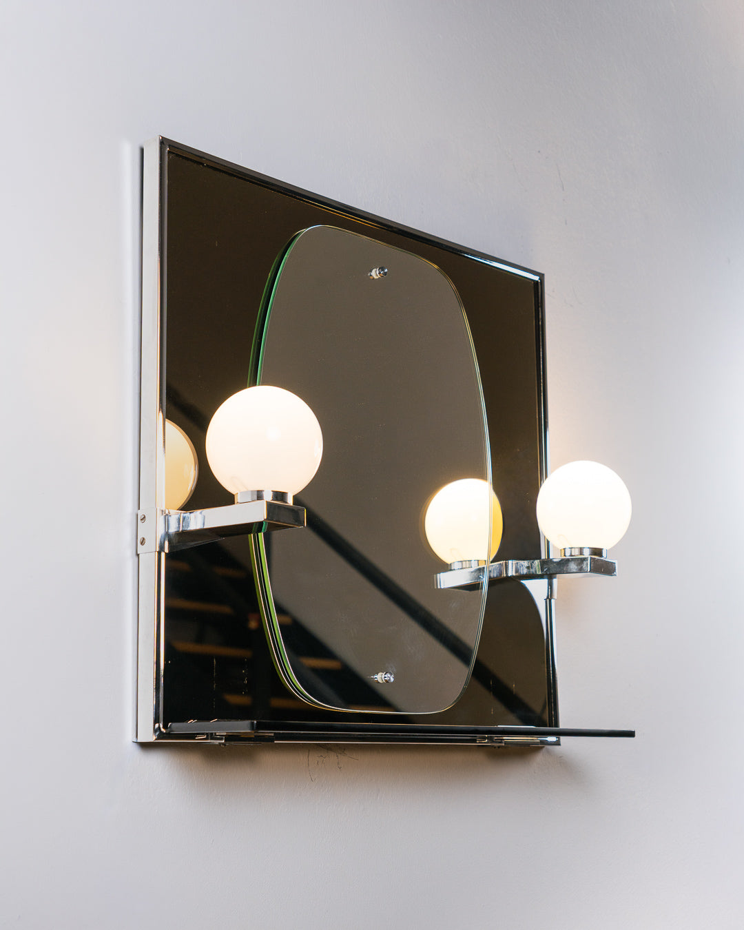 Vintage Space Age smoked black glass bathroom set from the 1970s with illuminated mirror, opaline globe sconces, shelf, acrylic towel holder and soap holder. Vecino Shop