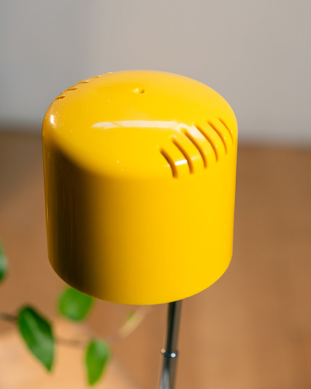 Vintage yellow folding pill-shaped table lamp from the 1970s with translucent glowing detail - night light ambient. Vecino Shop
