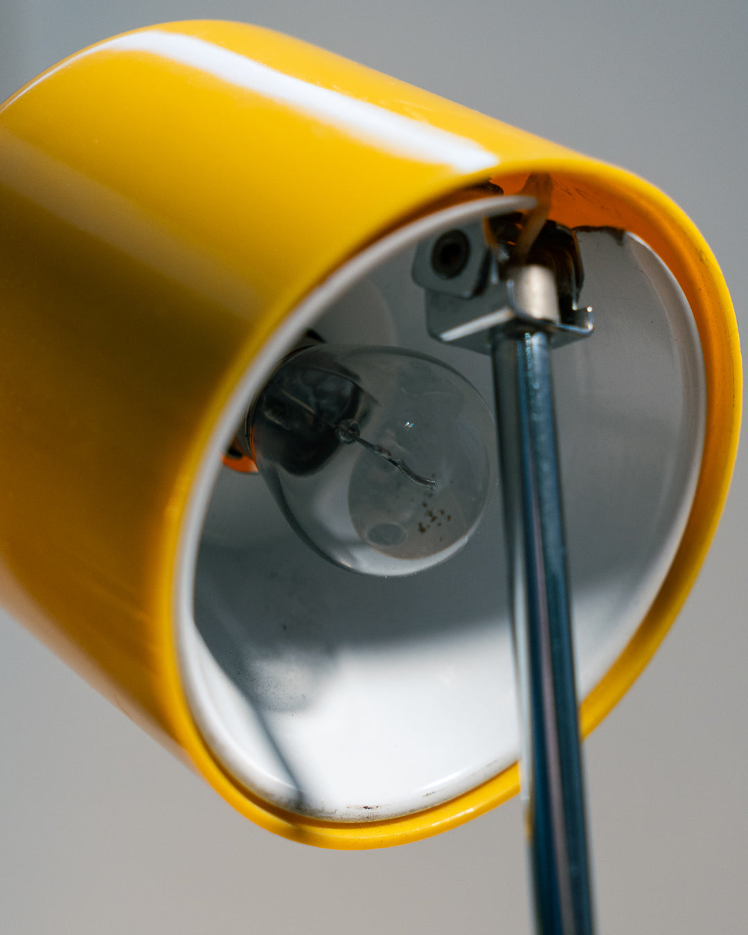 Vintage yellow folding pill-shaped table lamp from the 1970s with translucent glowing detail - night light ambient. Vecino Shop