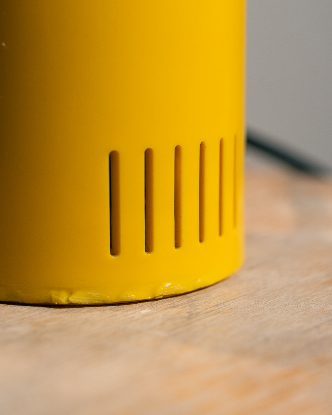 Vintage yellow folding pill-shaped table lamp from the 1970s with translucent glowing detail - night light ambient. Vecino Shop