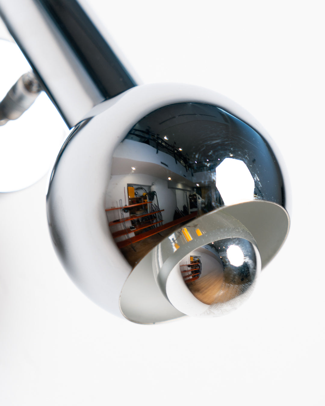 Vintage 1970s chrome adjustable eyeball spotlight wall sconce with chrome-tipped bulb. Mid Century, Space Age lighting.  Vecino Shop