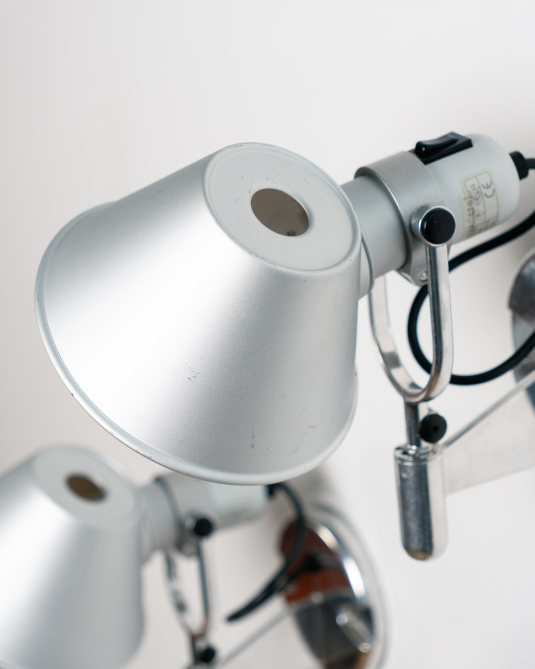 Vintage 1990s Artemide Tolomeo Faretto wall sconce in anodized aluminum with adjustable shade and integrated switch. Vecino Shop