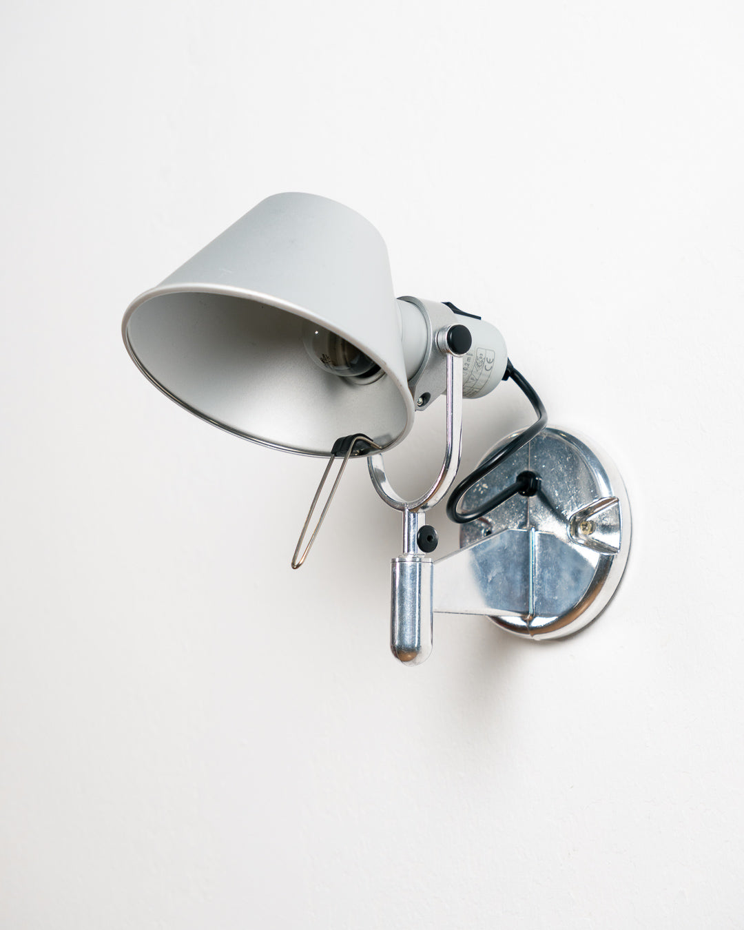 Vintage 1990s Artemide Tolomeo Faretto wall sconce in anodized aluminum with adjustable shade and integrated switch. Vecino Shop