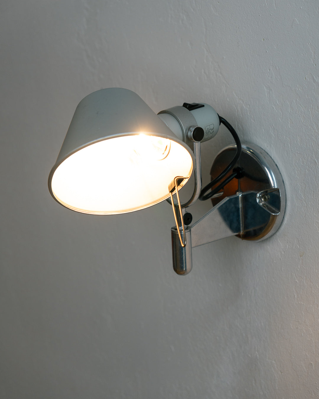 Vintage 1990s Artemide Tolomeo Faretto wall sconce in anodized aluminum with adjustable shade and integrated switch. Vecino Shop