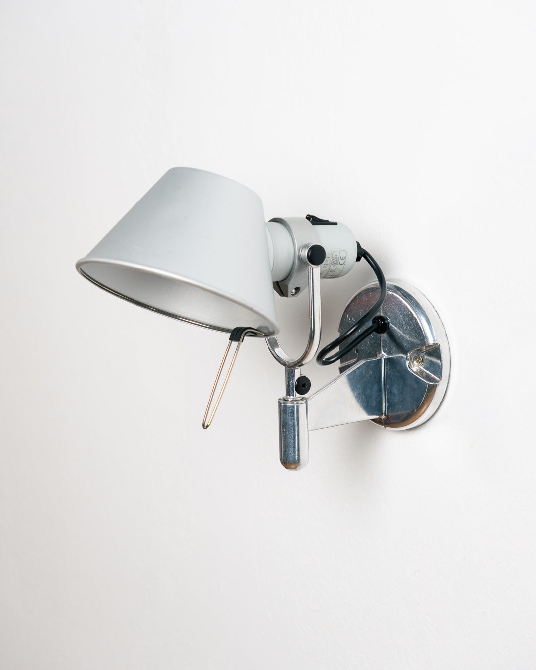 Vintage 1990s Artemide Tolomeo Faretto wall sconce in anodized aluminum with adjustable shade and integrated switch. Vecino Shop
