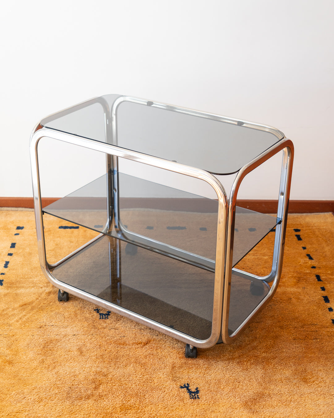Vintage 1970s chrome and smoked glass 3-tier side table with flattened tubular frame – Vecino Shop