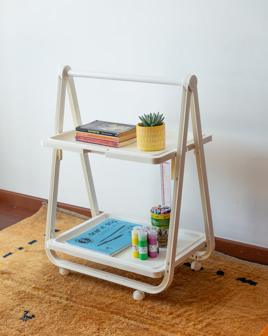 SIMO Italian folding plastic cart from the 1970s, vintage design with compact fold-flat system, versatile as a bar cart, side table, or storage unit. Excellent vintage condition with minor age-related signs. One-of-a-kind retro piece available at Vecino Shop.
