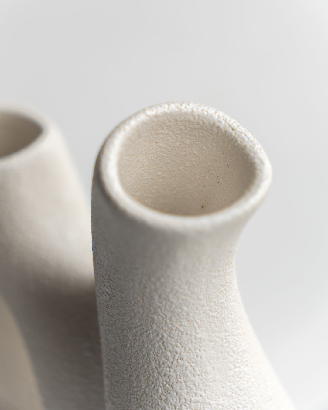 Vintage Italian double vase by Bertoncello with sculptural mid-century design, minimalist form, and textured ceramic glaze - Vecino Shop