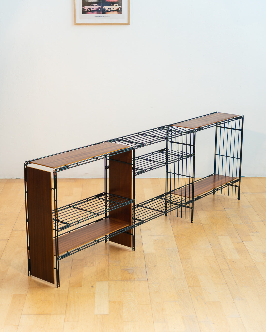 Vintage 1960s teak wood and matte black Multistrux modular string shelving system with twelve shelves, restored vintage design piece. Vecino Shop