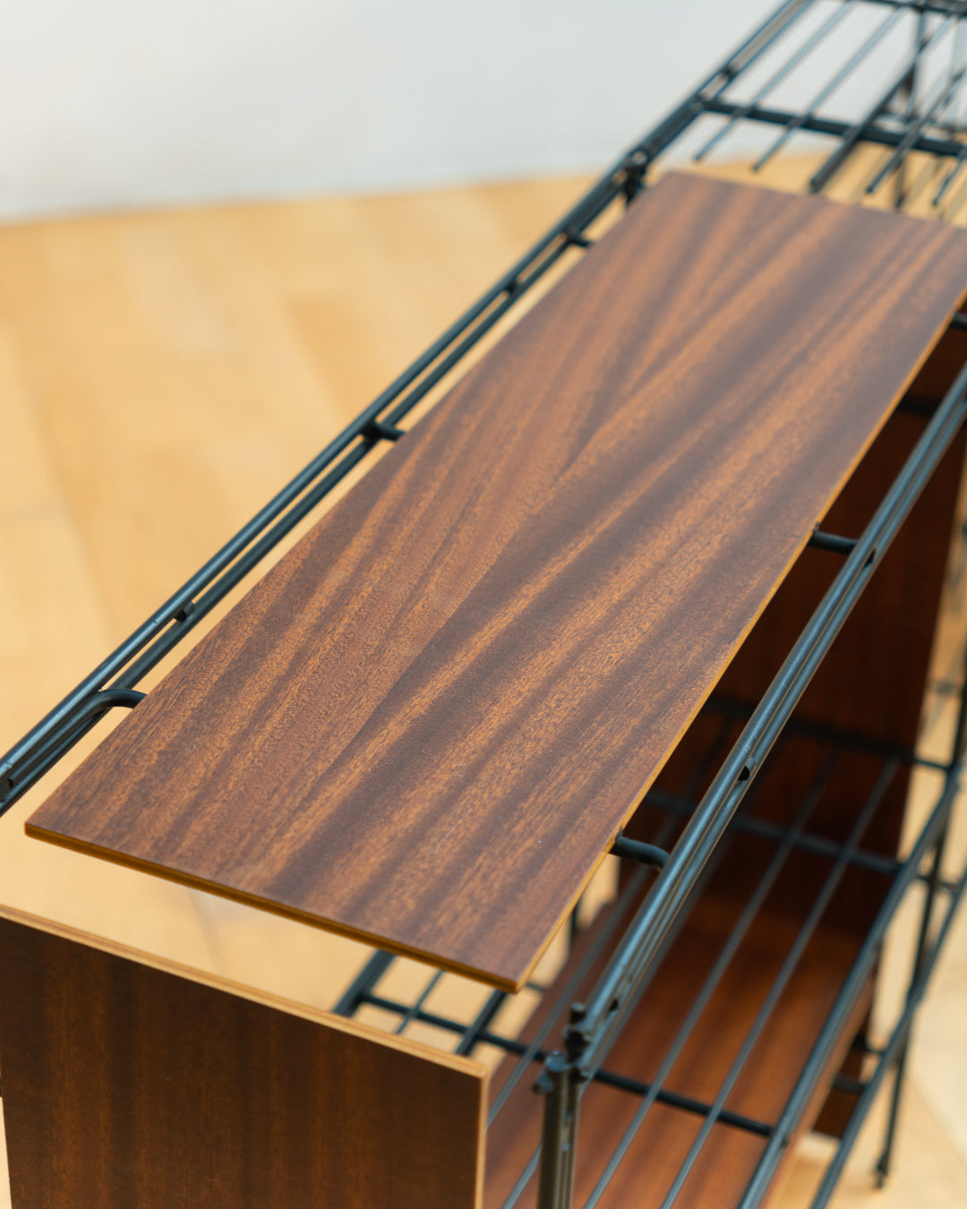 Vintage 1960s teak wood and matte black Multistrux modular string shelving system with twelve shelves, restored vintage design piece. Vecino Shop