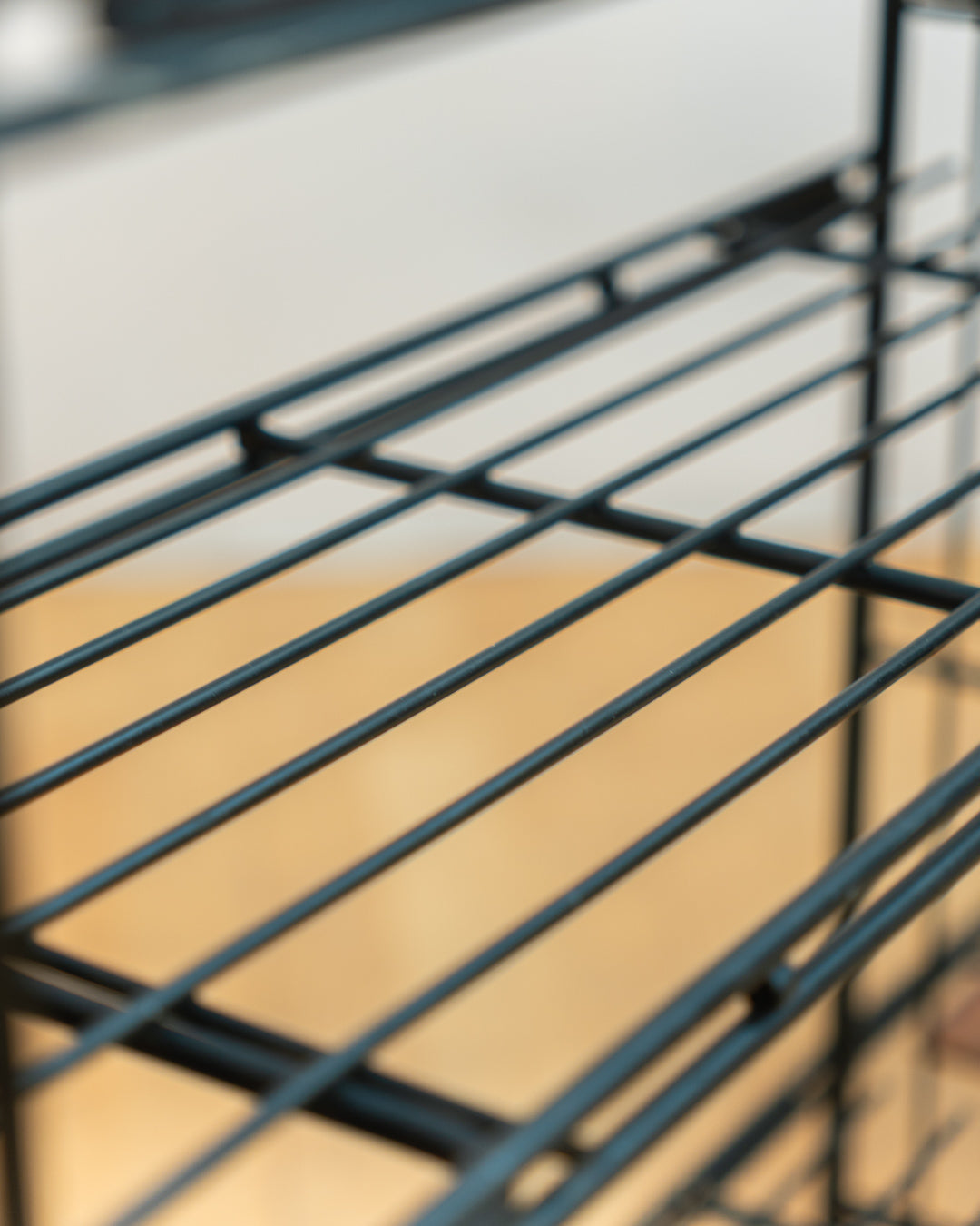 Vintage 1960s teak wood and matte black Multistrux modular string shelving system with twelve shelves, restored vintage design piece. Vecino Shop